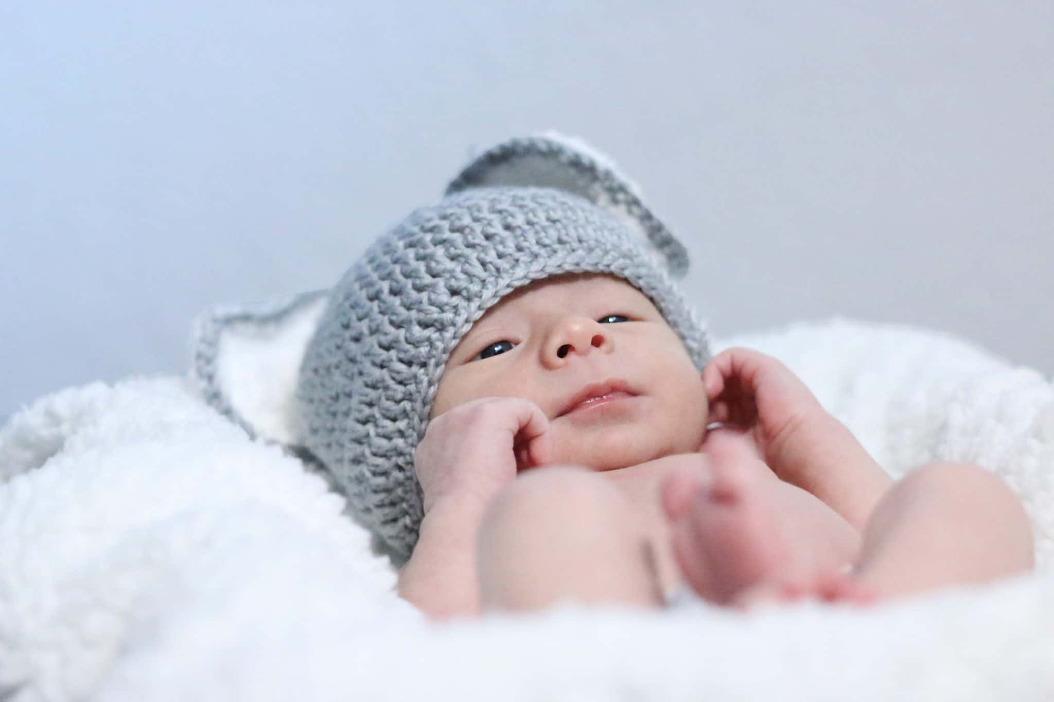 Newborn photo shoot with his animal ear beanie