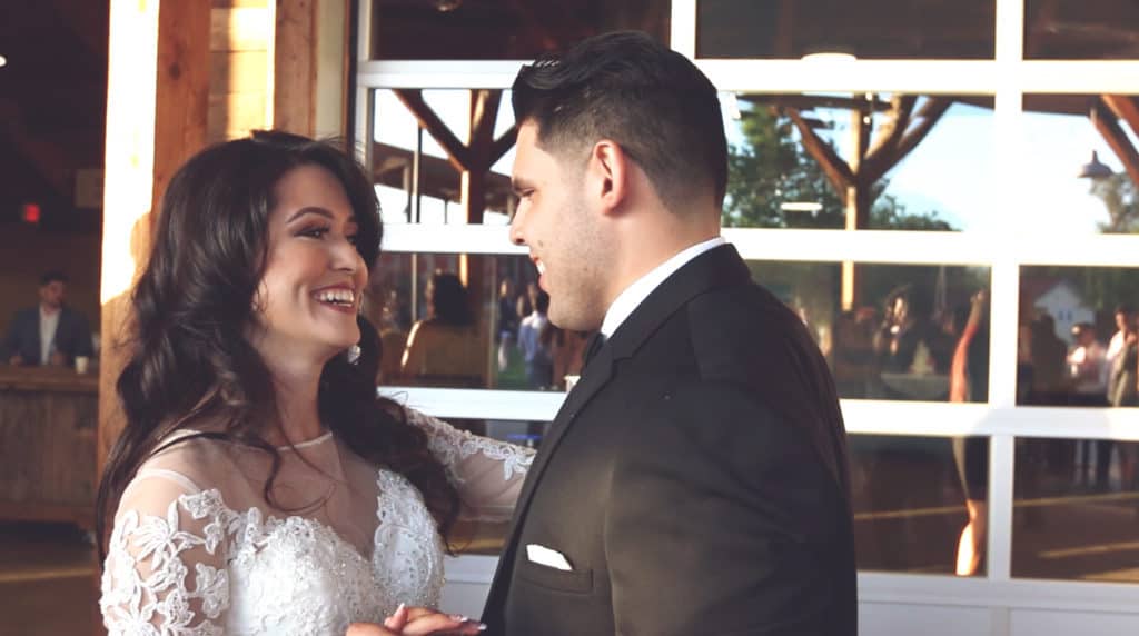 Newlyweds Monica & Silvano with glowing smiles on their wedding day